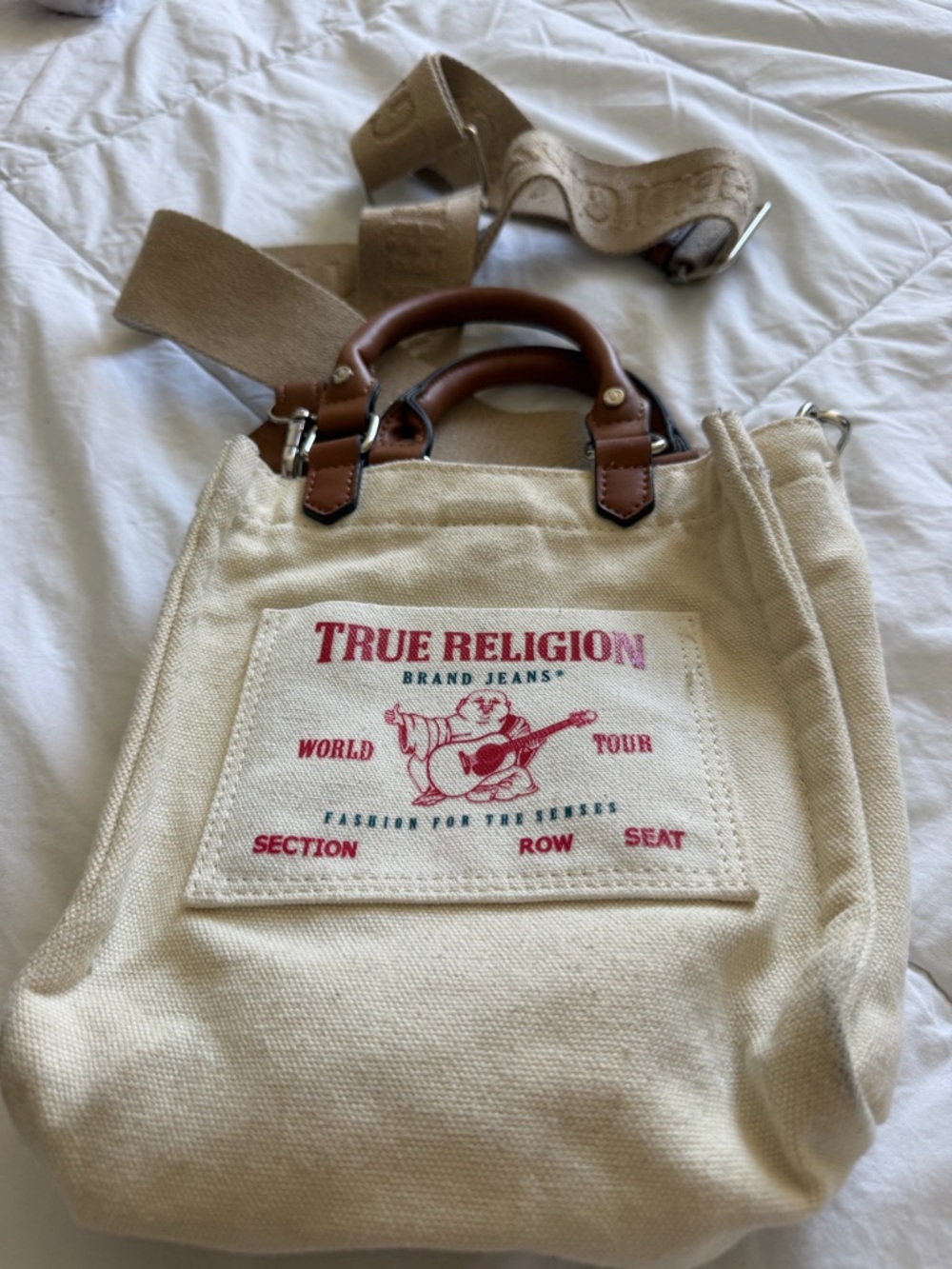 True Religion Cream Canvas Tote with Brown Leather Handles and Red Logo
